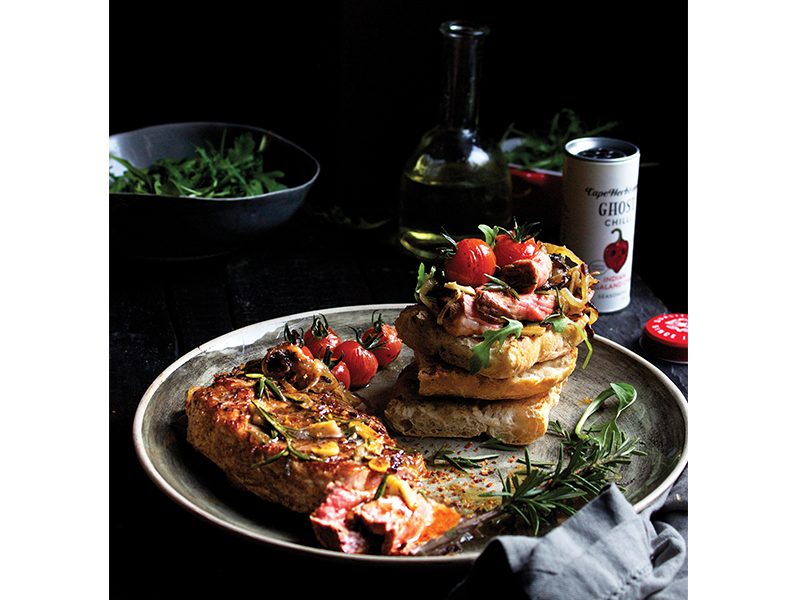 GHOST CHILLI PREGO ROLL WITH CARAMELISED ONIONS & PAN-ROASTED TOMATOES